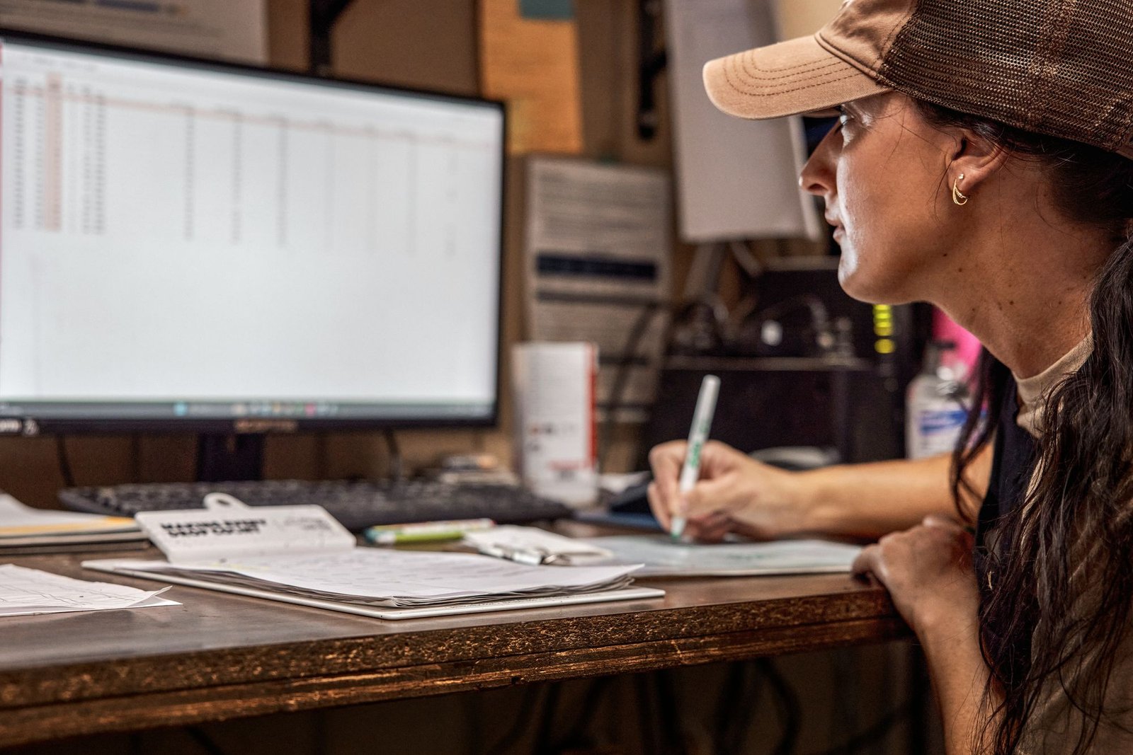 A small business owner working at her desk